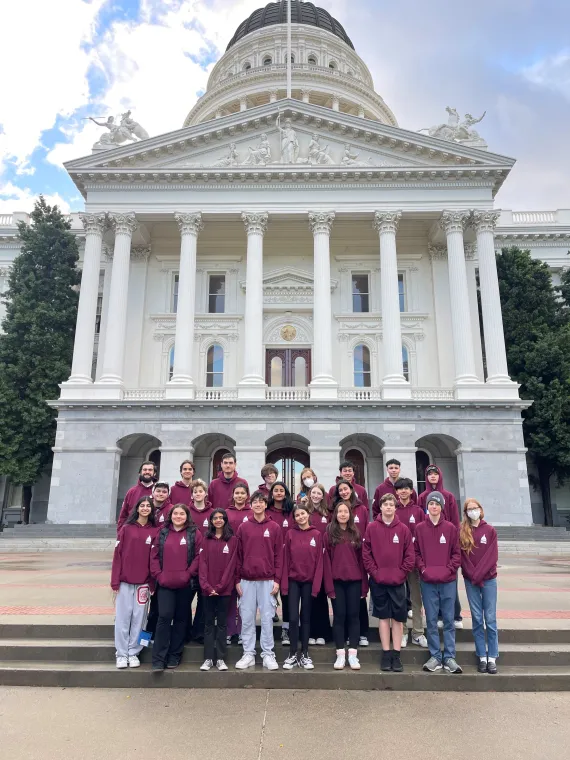 A group of YMCA teens in front of the Capitol