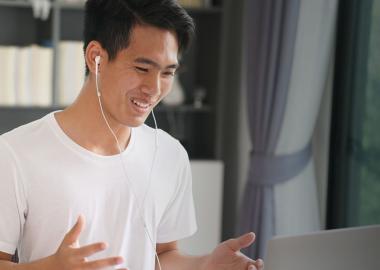 Teen leader engaged in online meeting.