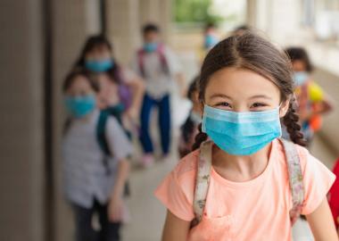 Happy student with mask