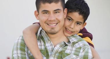 father and son hugging