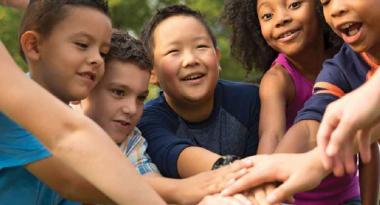 youth together with hands in middle