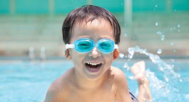 Youth enjoying outdoor swimming pool